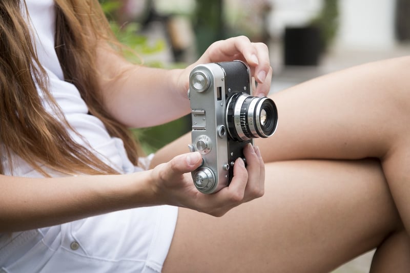 Celebrity hiding behind a camera